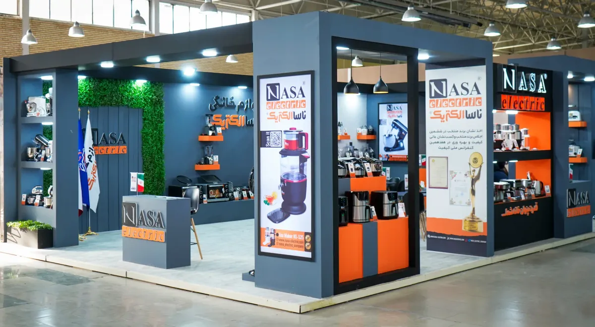 Exhibition booth displaying NASA Electric Company products at a specialized household appliances exhibition in Iran, showcasing a collection of high-quality and modernly designed appliances.