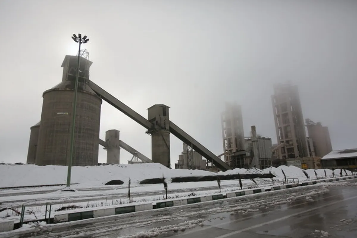 A view of the equipment and interior space of Kurdistan Cement Factory, including machinery and industrial structures