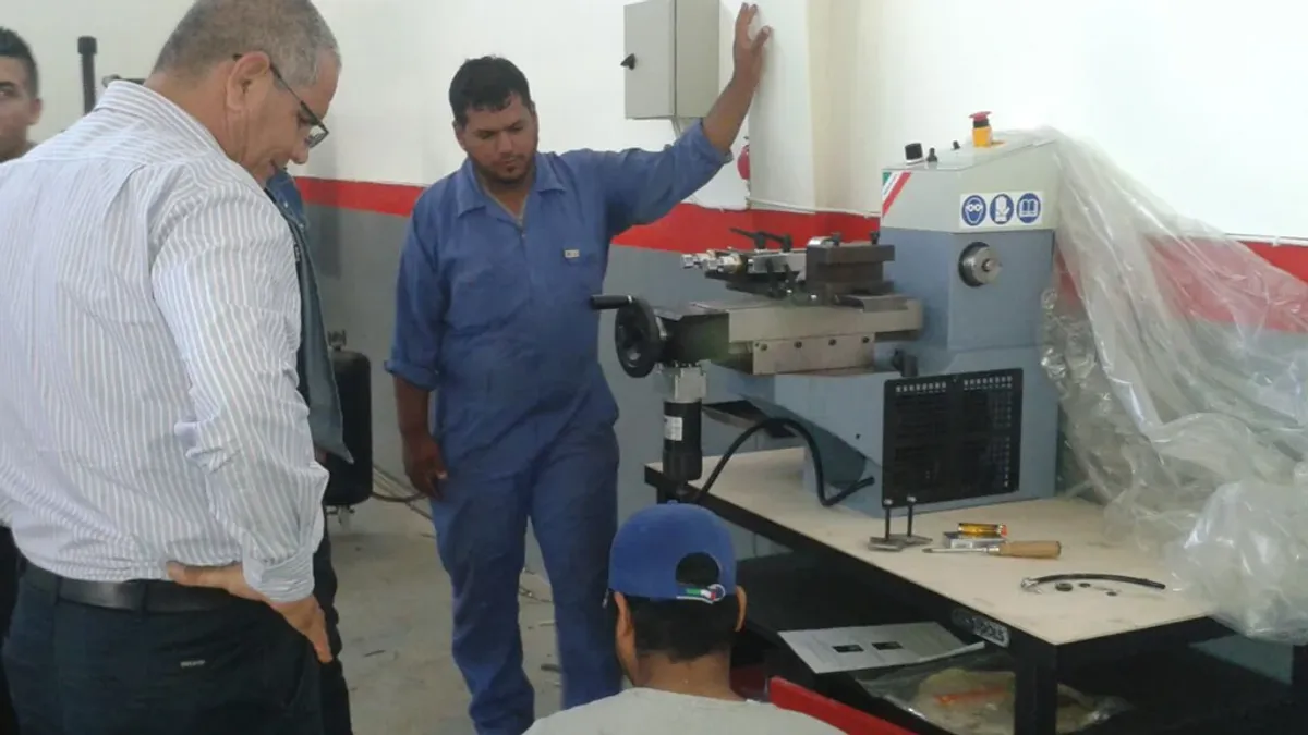 Staff inspecting and evaluating equipment at the project site