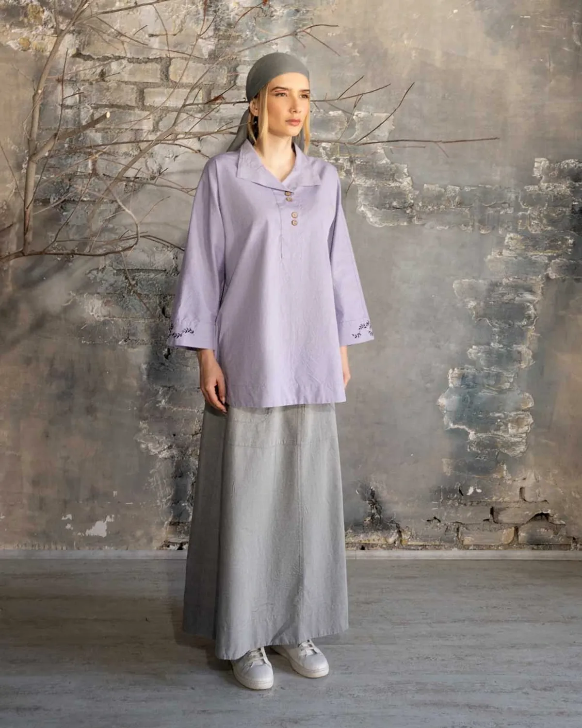 A woman wearing a Moonlight blouse and skirt, with a beautiful and attractive style.